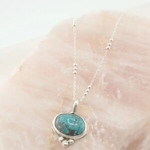 TURQUOISE BACK HEART CUT-OUT PENDANT IN STERLING SILVER METAL